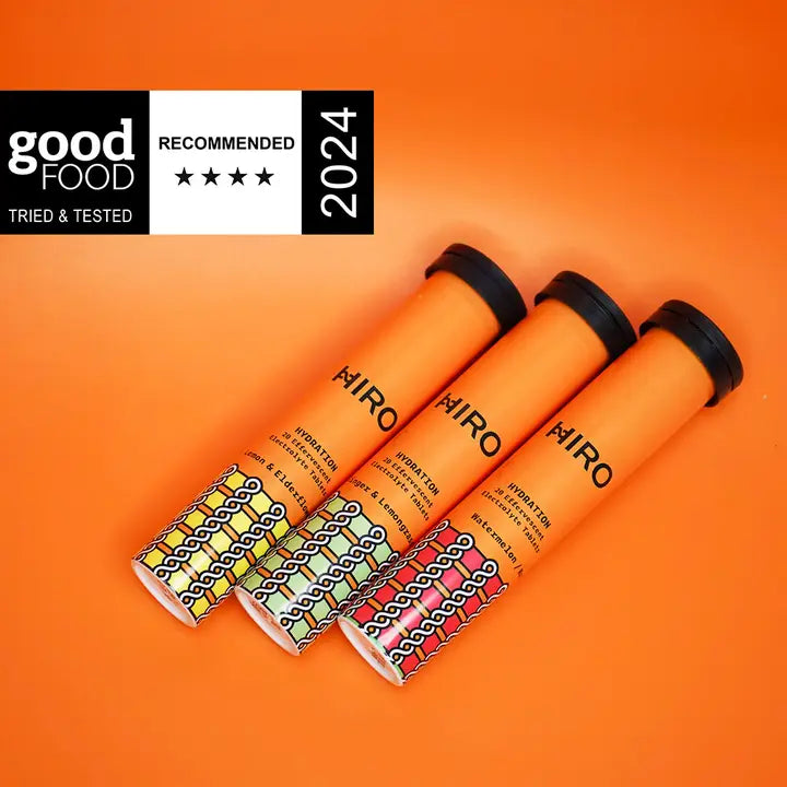 Four orange tubes with black lids on an orange background, featuring 'HIRO' branding and a 'Good Food' 2024 recommendation badge.