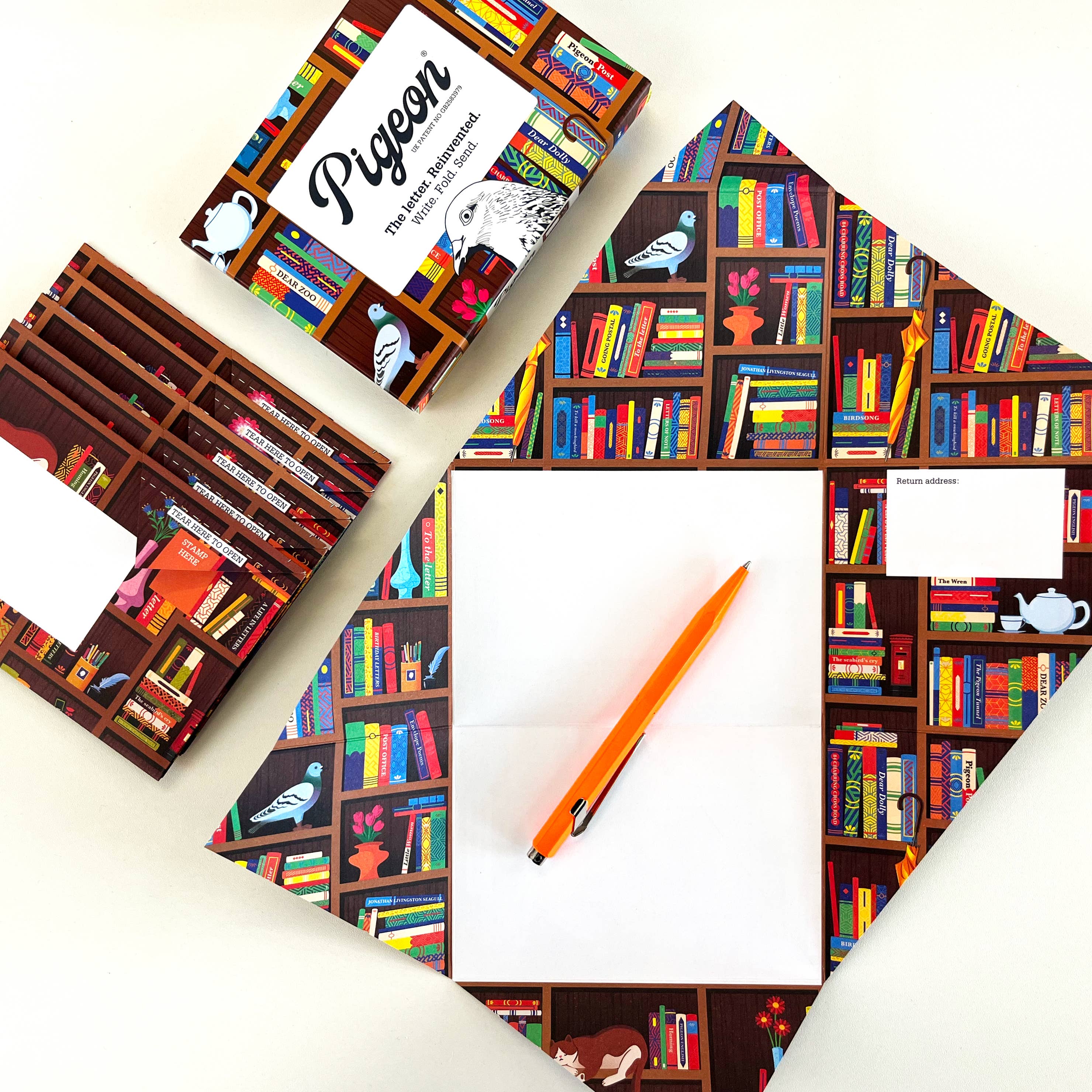 Colorful bookshelf-themed notebook with a pencil on a white background