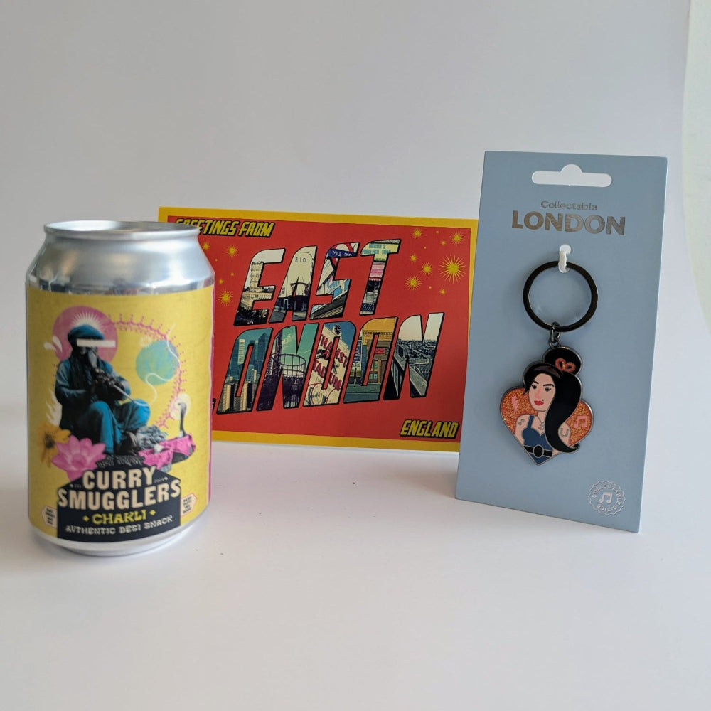 Curry Smugglers can, East London poster, and London keychain on a white background