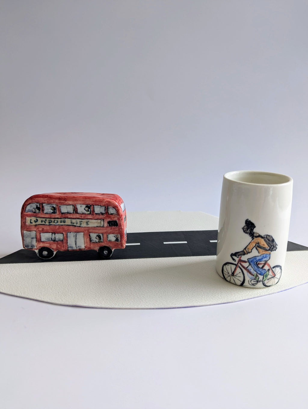 Collectables: Ceramic Bus + Bicyclist Beaker