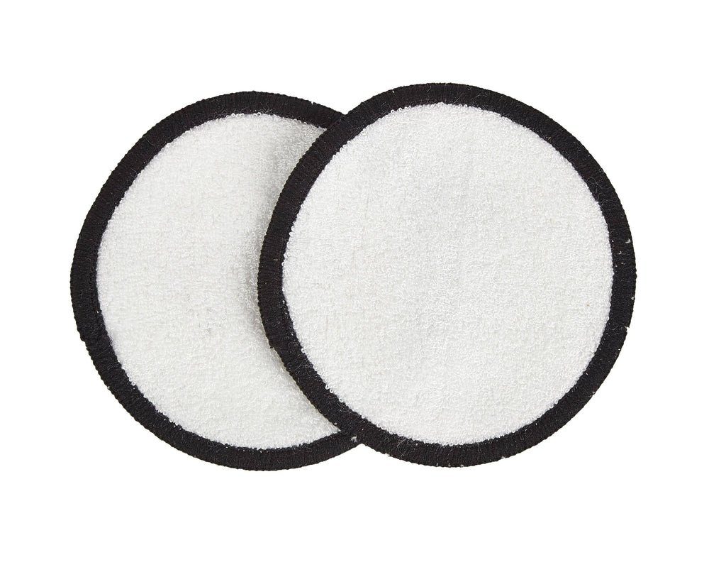 Two round white filters with black edges on a white background