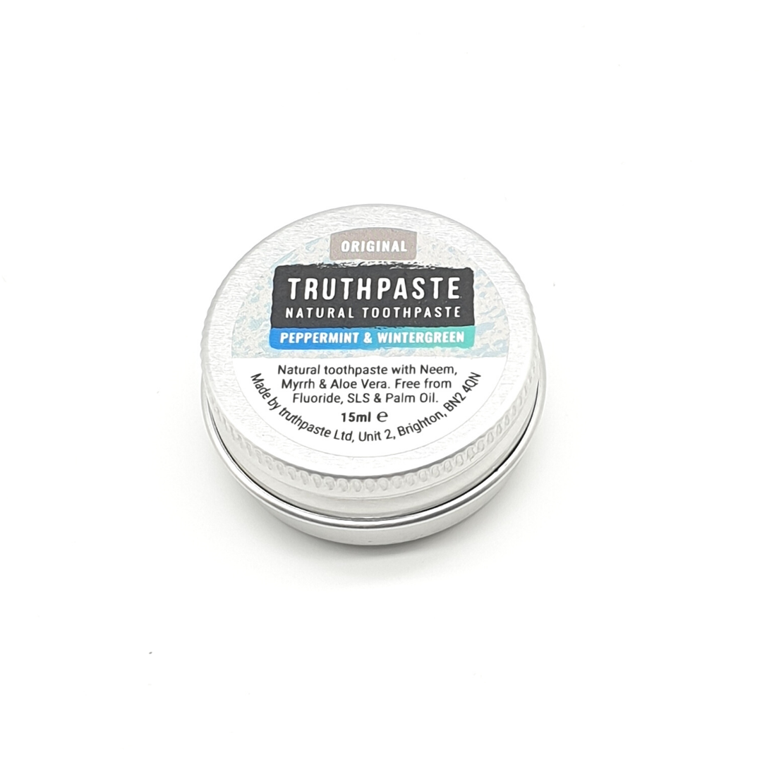 Truthpaste natural toothpaste tin on a white background